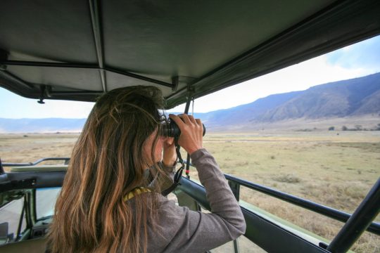 Ngorongoro,Crater,,Tanzania,Â€“,September,15,,2017:,Woman,Scanning,Ngorongoro